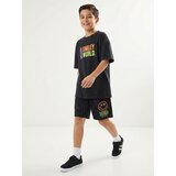 Sinsay Oversize majica s izblijedjelim efektom i printom na leđima SmileyWorld® | shoptok.hr