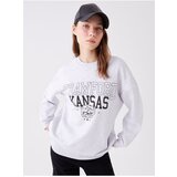 LC Waikiki Women's Crew Neck Printed Long Sleeve Oversized Sweatshirt. Cene