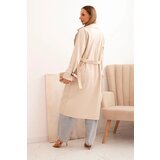 Kesi Włoski Women's eco-leather trench coat with a classic collar and a tied belt beige | ePonuda.com