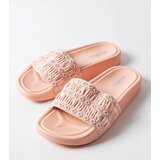 Gemre Ernest's pink sandals adorned with ruffles | Shoptok.si