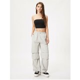 Koton Loose Parachute Trousers with Fold Detail. Cene