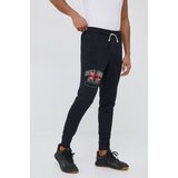 Under Armour Donji dio trenirke za muškarce, boja: crna, s tiskom | shoptok.hr