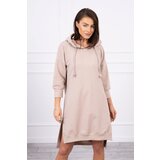 Kesi Dress with a hood and a longer back in beige color Cene