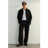 Trendyol Limited Edition Men's Black Wide Cut Denim Jeans with Contrast Stitching.