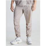 Calvin Klein Jeans Spodnji deli trenirke Wo Woven Bež Cene
