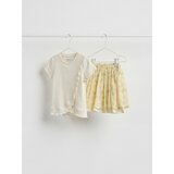 Reserved Rebrasta bluza s volanom - boja kože | shoptok.hr