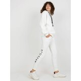 Fashion Hunters Ecru women's tracksuit with inscriptions and zippers Cene