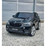 Džip BMW X6M dvosed na akumulator 2X120W sa kožnim sedištem i mekim gumama - metalik crni