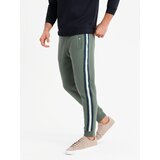 Ombre Men's sweatpants with piping and leg ribbing - olive Cene