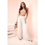 Kesi Włoski Women's wide trousers with elastic waistband beige Cijene