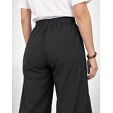 Lacoste Pantalon de surv&amp;ecirc;tement d&amp;eacute;perlant relaxed fit Crna Slike