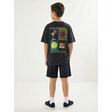 Sinsay Oversize majica s izblijedjelim efektom i printom na leđima SmileyWorld® | shoptok.hr