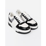 Shelvt Black and white sneakers with shimmering silver details | ePonuda.com