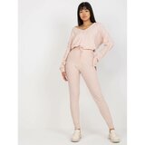 Fashion Hunters Light pink women's knitted trousers with a tie Cene
