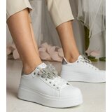 Gemre White-silver sneakers adorned with a butterfly with rhinestones Kariba Cene