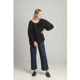 FASHION Black oversize blouse with a decorative flower Cijene