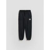 Reserved Jogger hlače isprana izgleda - crno | shoptok.hr