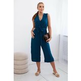 Kesi Jumpsuit with a tie at the waist with navy straps Cene