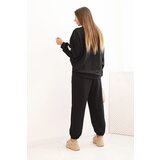 Kesi Włoski Ladies' butter set with a loose sweatshirt and pants with the word LOVE black | Shoptok.si