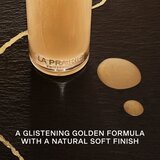 La Prairie Pure Gold Revitalising Essence obnovitvena esenca za obraz s pomirjajočim učinkom 130 ml | Shoptok.si