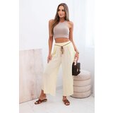 Kesi Włoski Women's viscose trousers with leg slit yellow | Shoptok.si