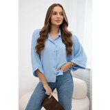 Kesi Oversized blouse with blue button fastening Cene