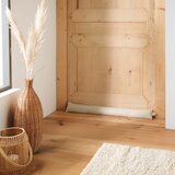 Douceur d intérieur Kremno bela zaščita za vrata proti prepihu 10x80 cm Wooly – | Shoptok.si