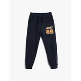 Koton Jogger Sweatpants with Tied Waist and Sports Print Detail