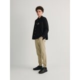 Reserved hlače jogger slim fit - bež Cene