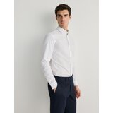 Reserved - Slim hlače izglačane na crtu - mornarsko plava | shoptok.hr