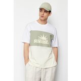 Trendyol mint men's relaxed/comfortable cut text printed color blocked 100% cotton short sleeve t-shirt Cene