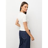 Sinsay Rebrasta bluza s dodatkom viskoze i ukrasnim gumbima Slike