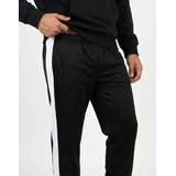 Puma Spodnji deli trenirke ESS T7 Poly Pants Črna | Shoptok.si