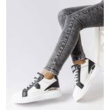 Gemre White and black sneakers with a silver accent Via | Shoptok.si