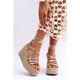 Kesi Leather sandals on a wedge of gold Margaritt