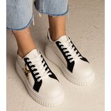 Gemre White and black sneakers decorated with glitter and a star Taleda | Shoptok.si