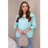 Kesi Cotton blouse with ruffles on the shoulders mint Cijene