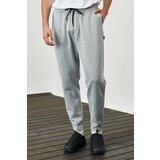AC&Co / Altınyıldız Classics Men's Light Gray Melange Standard Fit Normal Cut Comfortable Sports Sweatpants with Elastic Waist and Legs Cene