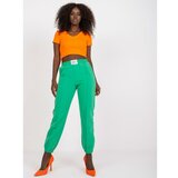 Fashion Hunters Dark green women's trousers in a fabric with a crease Cene