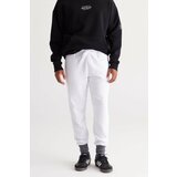 AC&Co / Altınyıldız Classics Men's White Standard Fit Normal Cut Comfortable Cotton Sweatpants with Side Pockets. Cene