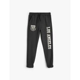 Koton boys jogger sweatpants with print detail, tie waist and pocket Cene