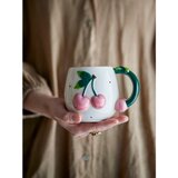 Bloomingville Kremno bela keramična skodelica 420 ml Berrie – | Shoptok.si