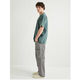 Koton Trousers with Cargo Pocket Buttoned Comfort Fit Zipper Detail cene