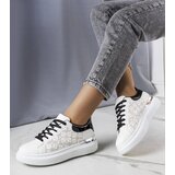 Gemre White and black sneakers decorated with perforation Erin | Shoptok.si