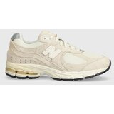New Balance Superge M2002RCC bež barva Cene