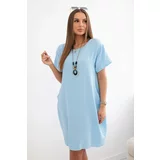 Kesi Dress with pockets and a blue pendant
