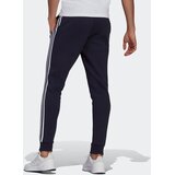Adidas Športne hlače 'Essentials Fleece Tapered Cuff 3-Stripes' modra / bela | Shoptok.si