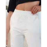 DStreet Spodnie damskie dresowe SWAN ecru | Shoptok.si