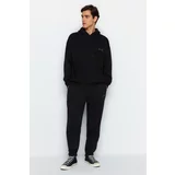 Trendyol Black Men's Oversized Hooded Rubber Legs with Embroidery Pipe, Soft Pillow and Cotton Tracksuit Set.