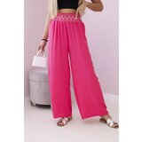Kesi Trousers with a wide elastic waistband in pink color Cene